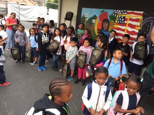 Students at backpack giveaway